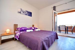 Postel nebo postele na pokoji v ubytování Apartments Clara