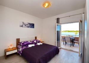 Postel nebo postele na pokoji v ubytování Apartments Clara
