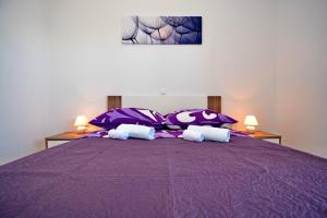 Postel nebo postele na pokoji v ubytování Apartments Clara