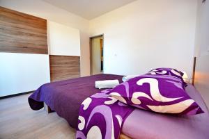 Postel nebo postele na pokoji v ubytování Apartments Clara