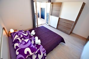 Postel nebo postele na pokoji v ubytování Apartments Clara