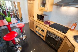 A kitchen or kitchenette at Luxury Apartment in Paris Center - Louvre Museum