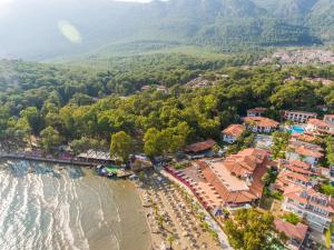 an aerial view of a resort with a beach at Yucelen Hotel in Akyaka