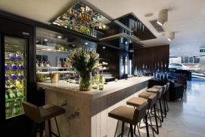 a bar in a restaurant with stools at Endless Art Hotel-Special Category in Istanbul