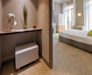 Ліжко або ліжка в номері Hôtel La Villa Tosca