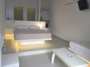 Voodi või voodid majutusasutuse Manolia View Mykonos toas