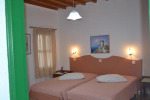 Cama ou camas em um quarto em Studios Flora Manos