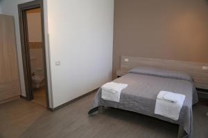 Postel nebo postele na pokoji v ubytování Solandra Affittacamere