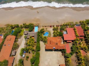 an aerial view of a house on the beach at Solyar Luxury Spanish Beachfront Home in Pochomil