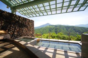 a swimming pool with a view of mountains at Sky Park Hotel in Chino