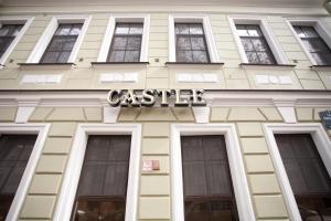 a building with a castle sign on the front of it at Castle in Saint Petersburg