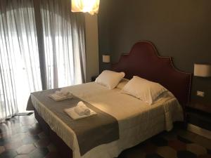 Ein Bett oder Betten in einem Zimmer der Unterkunft Residenza Roma Imperiale