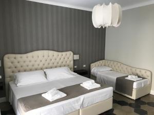Ein Bett oder Betten in einem Zimmer der Unterkunft Residenza Roma Imperiale