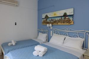 Postel nebo postele na pokoji v ubytování Hotel Kastro