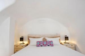 Ένα ή περισσότερα κρεβάτια σε δωμάτιο στο Allure Suites