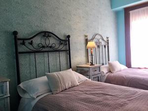 Posteľ alebo postele v izbe v ubytovaní Apartamentos Turísticos Luar II