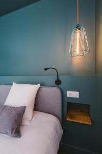 Postel nebo postele na pokoji v ubytování Le Petit Cosy Hôtel