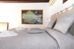a bed with two pillows on top of it at Ca RIZZI in Venice