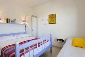 a bedroom with a blue and white bed in it at Apartment Vesna in Zadar +47 photos