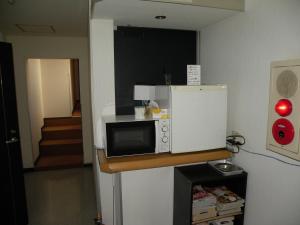 Kuchyň nebo kuchyňský kout v ubytování Business Hotel Minshuku Minato