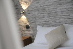 Postel nebo postele na pokoji v ubytování Aurelia Rooms