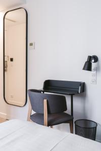 Postel nebo postele na pokoji v ubytování Le Petit Cosy Hôtel