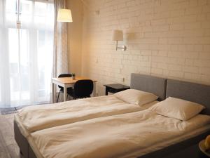 מיטה או מיטות בחדר ב-Garden Hill Apartments