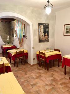 a restaurant with tables and chairs in a room at Sant'Antonio in Volterra