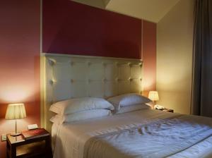 Postel nebo postele na pokoji v ubytování Hotel 500 Firenze