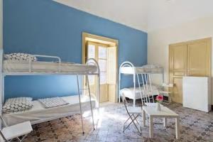 Postel nebo postele na pokoji v ubytování Sunshine Hostel Palermo