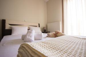Posteľ alebo postele v izbe v ubytovaní Keramoti Luxury Apartments