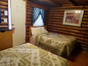 Katil atau katil-katil dalam bilik di Seven Dwarfs Cabin - On The Brook Cabins