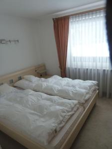 Postel nebo postele na pokoji v ubytování Appartement-Oberwiesenhof