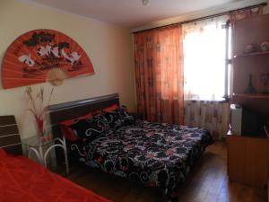 a bedroom with a bed and a window at Dom on the seaside in Zatoka