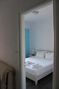 Tempat tidur dalam kamar di Residence La Scala