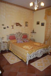 a bedroom with a large bed in a room at Sette Nani in Elmas