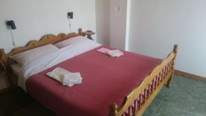 Ένα ή περισσότερα κρεβάτια σε δωμάτιο στο Apartmani Škrnjug