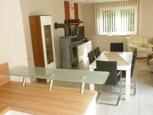 a kitchen and dining room with a glass table at Wohnung-1 in Mardorf