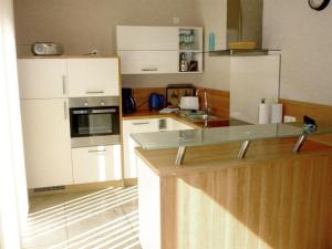 a kitchen with a counter and a stove top oven at Wohnung-1 in Mardorf