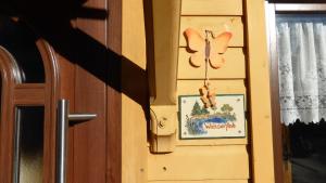 a door with a picture of a mouse on the wall at Ferienwohnung-Wasserfloh in Mulde