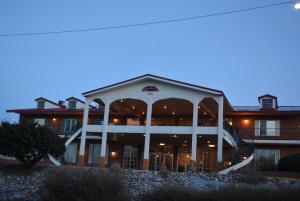 a large building with a large gazebo at Travelodge by Wyndham Trinidad in Trinidad