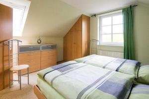 Ferienhaus Jan tesisinde bir odada yatak veya yataklar