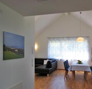 a living room with a couch and a table at Buche in Überlingen