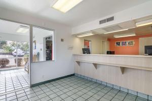 a lobby of a hospital with a reception counter at Motel 6-Topeka, KS - Northwest in Topeka