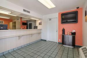 a kitchen with a refrigerator and a microwave at Motel 6-Topeka, KS - Northwest in Topeka