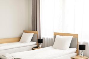 Postel nebo postele na pokoji v ubytování Waw Hotel Airport Okęcie