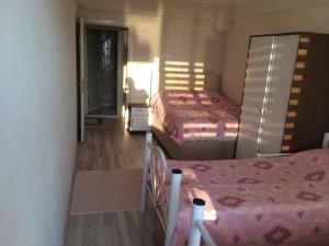 A bed or beds in a room at Gerze Apart Otel
