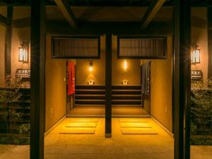 a hallway of a building at night at Kurokawa-So in Minamioguni
