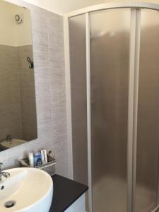 a bathroom with a shower and a sink at Casale Del Borgo in Hermada