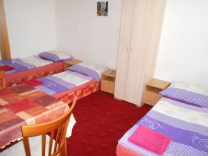 Postel nebo postele na pokoji v ubytování Penzion Apartmány Zlín